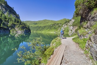 Hikers at Tappenkarsee, reflection, mountain lake, Radstätter Tauern, landscape conservation area,