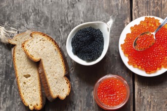 Different kinds of caviar with bread and beverages, AI generated