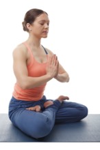 Beautiful sporty fit yogini woman meditates in yoga asana Padmasana, lotus pose with namaste