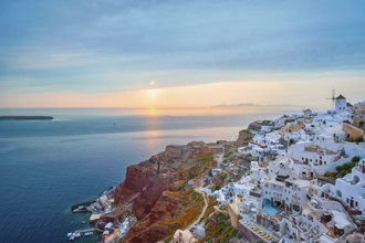 Famous greek iconic selfie spot tourist destination Oia village with traditional white houses and