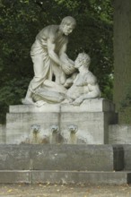 Samaritan fountain with two figures, fountain, Samaritan, allegory, help, helper, charity, give,