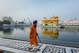 AMRITSAR, INDIA, AUGUST 26, 2011: Sikh guard in Golden Temple Sri Harmandir Sahib Gurdwara in