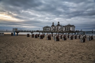 Empty beach chairs in front of the pier Sellin at dusk, long exposure, Baltic resort Sellin, Insel