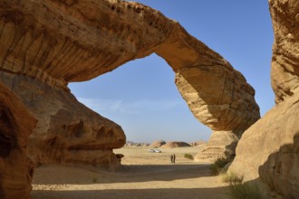 Tourists at The Arch, also known as Rainbow Rock, near AlUla, Medina Province, Saudi Arabia,