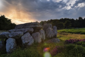 Menhirs near Carnac, megalithic culture, sunset, backlight, coloured light reflections, Brittany,