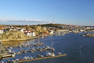 View over archipelago and boats, small harbour, clear autumn day in Kungshamm, Bohuslän, Sweden,