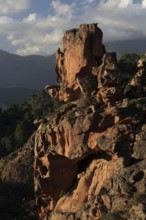 Bizarre red rock landscape in the evening light, Calanques de Piana, Corsica, France, Europe