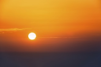 Orange sunrise over the sea, backlight, text free space, Spain, Europe