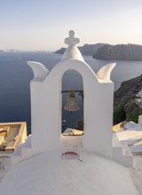 Whitewashed bell-tower wiith a view of caldera and sea, Ia, Oia, Santorini, Greece, Europe