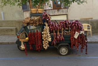 Piaggio tricycle van as a sales stand with onions and herbs, Tropea, Vibo Valentia, Calabria,