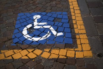 Reserved for wheelchair, severely disabled, marking on pavement, Ortisei, Val Gardena, South Tyrol,