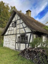 Historic reed thatched old rebuilt restored half-timbered house day labourer's house from Delkhofen