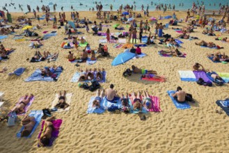 Crowded beach with people in August, San Sebastian, Donostia, Basque Country, Northern Spain,