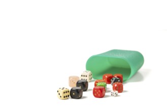 Various dice, green dice cup, white background, copying room