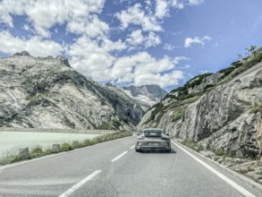 Photo with reduced saturation Porsche 911 GT3 on pass road of Grimselpass, Canton Uri, Switzerland,