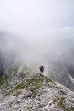 Mountaineer in fog, bad weather, Wetterstein Mountains, Garmisch-Patenkirchen, Bavaria, Germany,