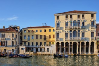 VENICE, ITALY, JUNE 27, 2018: Grand Canal with boats and gondolas on sunset, Venice, Italy, Europe