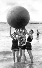 Bathing group on the beach, four woman with a big ball, funny, laughing, summer holidays, holiday,