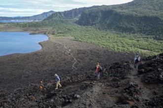 Hikers at the still active volcano Mount Tavurvur, Rabaul, East New Britain, Bismarck Archipelago,