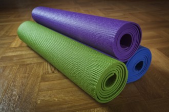 Yoga mats on wooden floor