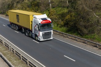 Uniocean heavy goods vehicle carrying MSC container, A14, near Felixstowe, Suffolk, England, UK