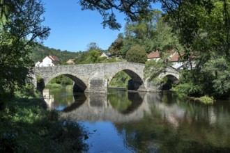 The old medieval bridge at Menat over the river Sioule. Puy de Dome department.