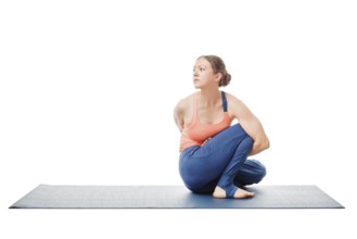 Woman doing Ashtanga Vinyasa Yoga stretching asana Marichyasana D, pose posture dedicated to sage