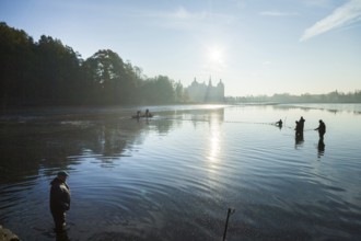 Fishing of the castle pond in Moritzburg