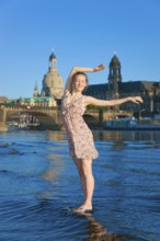 Young woman on the Elbe meadows in Dresden