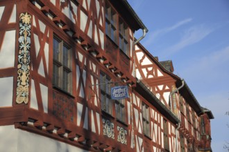 Historic Amthof and landmark, half-timbered house, nose sign, gallery, Bad Camberg, Taunus, Hesse,