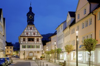 Old town hall in Künzelsau pedestrian zone illuminated Germany