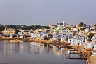 PUSHKAR, INDIA, NOVEMBER 20, 2012: Hindu devotees pilgrims bathing in sacred Puskhar lake (Sagar)