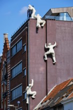 ANTWERP, BELGIUM, MAY 26, 2018: De fluisteraar (The whisperer) statue in Antwerp, Belgium, Europe