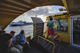 Passengers on a harbour ferry on the Norderelbe, Hamburg, Germany, Europe