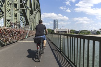 Cycling from a first-person perspective on a shared footpath and cycle path over the Hohenzollern