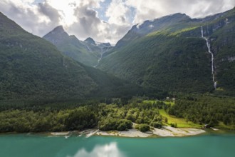 Lake Lovatnet, turquoise lake with mountain flanks and waterfalls, Loen, Stryn, Fe, Norway, Europe