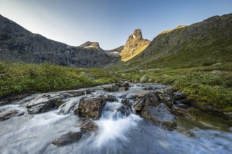 River in Venjesdalen valley, Romsdalshornet mountain, Åndalsnes, Møre og Romsdal, Norway, Europe