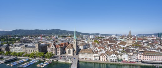 Panorama, view over the old town of Zurich with river Limmat, church Fraumünster and Münsterbrücke,