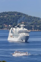 Cruise ship and boat in the sea off the Mediterranean island of Skiathos, Greece, Europe