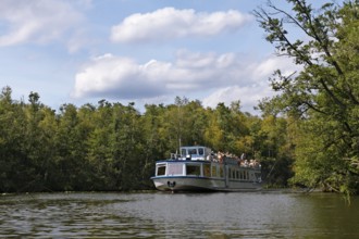 Passenger boat in the canals of the Havel on the lake district, Müritz National Park,