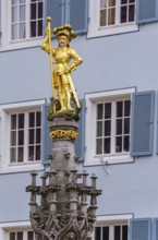 Statue of St. George standing on the defeated dragon, Georgsbrunnen on the Münsterplatz, Freiburg