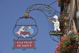 Hanging sign on an Alsatian restaurant, Eguisheim, Département Haut-Rhin, Alsace, France, Europe