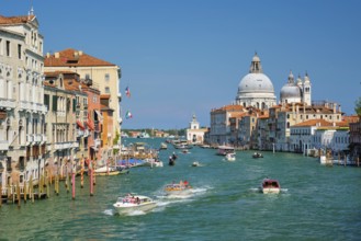 VENICE, ITALY, JULY 19, 2019: View of Venice Grand Canal with boats and Santa Maria della Salute