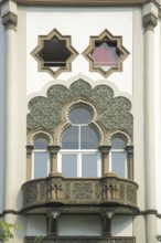 Moorish building with balcony and ornaments, Moorish, star-shaped, stars, two, windows, open, to,