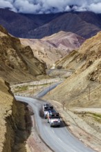 Indian lorry cistern fuel tanker trucks on NH-1 (Srinagar Leh national highway) in Himalayas.