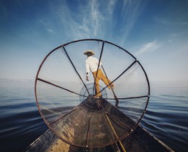 Myanmar travel attraction, Traditional Burmese fisherman with fishing net at Inle lake in Myanmar,