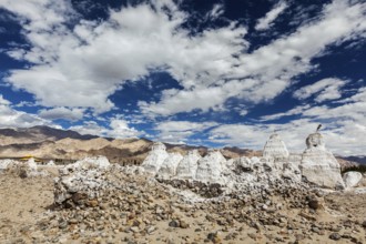 Whitewashed chortens (Tibetan Buddhist stupas) . Ladakh, Jammu and Kashmir, India, Asia