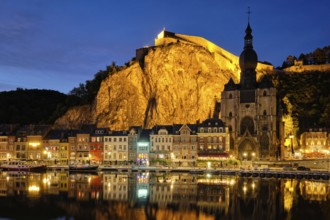 Night view of Dinant town, Collegiate Church of Notre Dame de Dinant over River Meuse and Pont