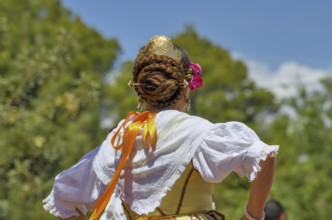 Hairdo of a woman at the annual fiesta in honour of San Vicent in Cautivador or Captivador,