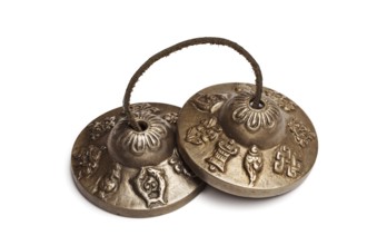 Tibetan Buddhist tingsha cymbals isolated on white